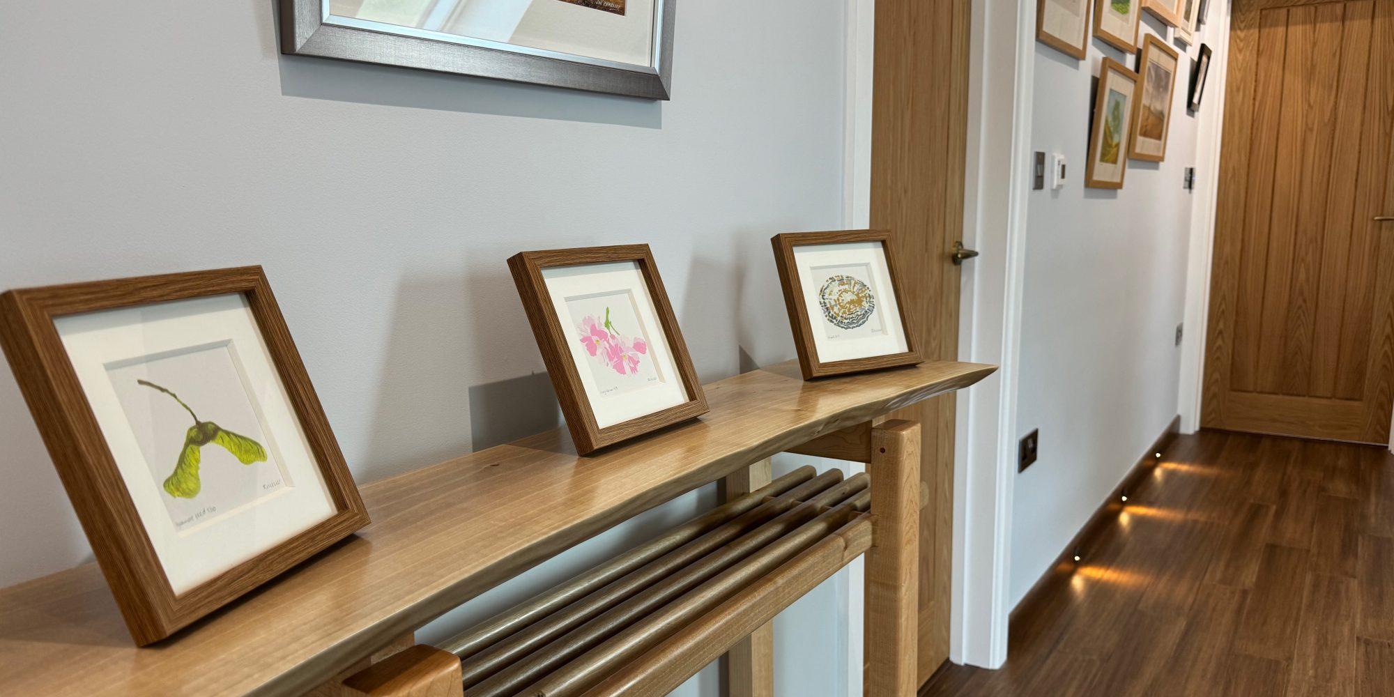 Simon Denton: bespoke console table with Kate Miller prints
